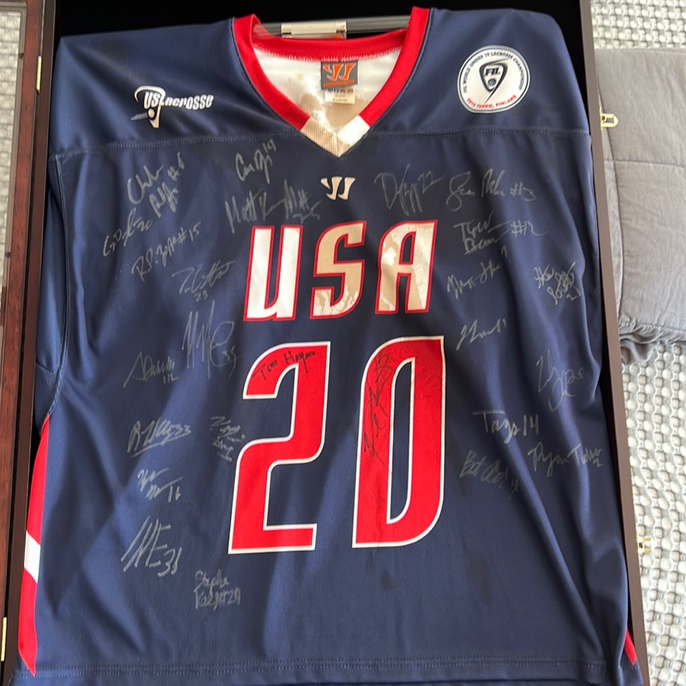 Game played 2012 USA mens U19 lacrosse jersey #20 signed by the whole team.
